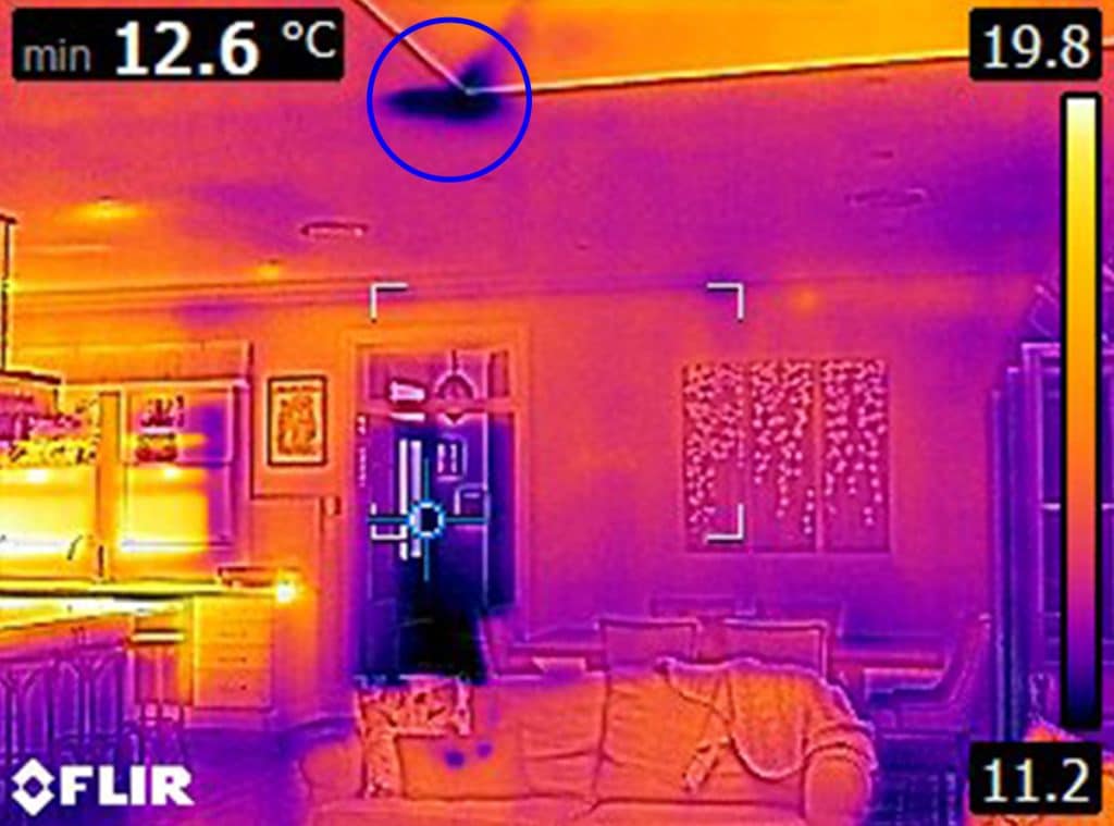 The same family loungeroom examined by a building inspector using a thermal camera to show the unseen building issues.